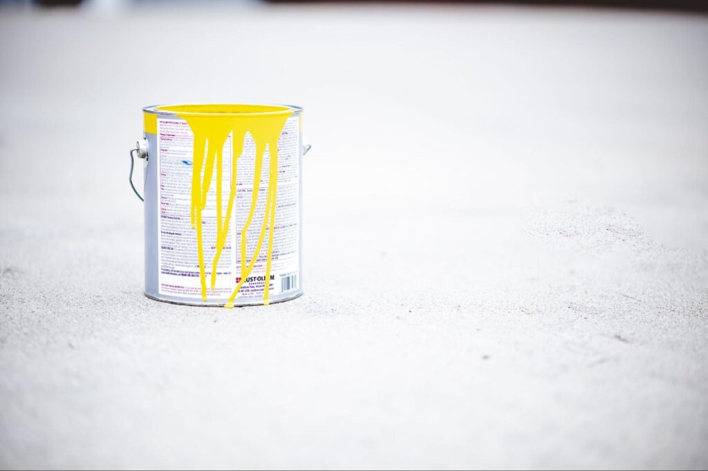 Paint bucket on a concrete floor.