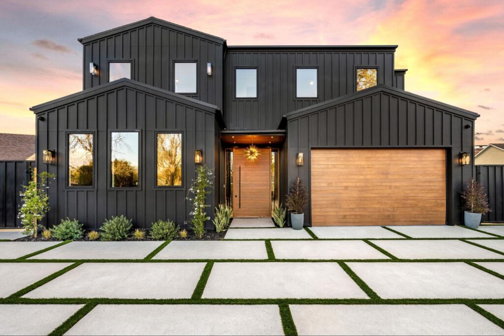 A front view of a modern home that is painted black.